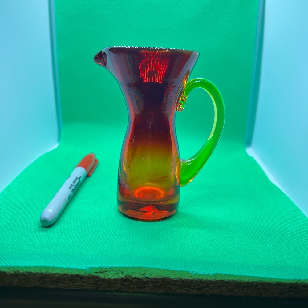 Antique colorful creamer cup, really a pleasure to look at in the sun